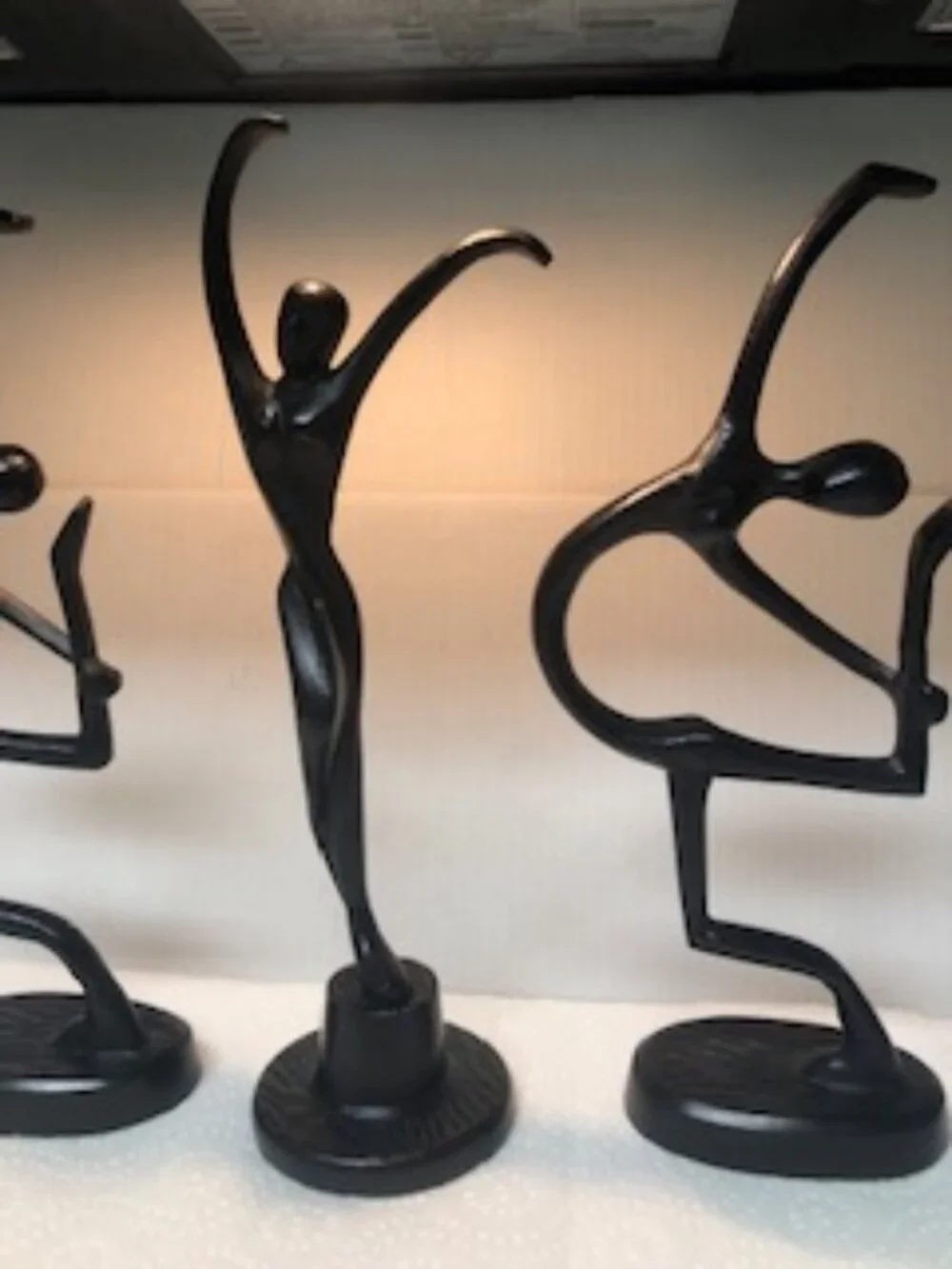 Three dancers female cast metal sculptures designed by Bodrul Khalique for IKEA